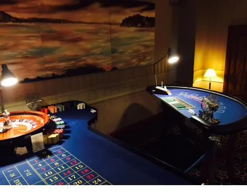 Guests placing bets at the blackjack table